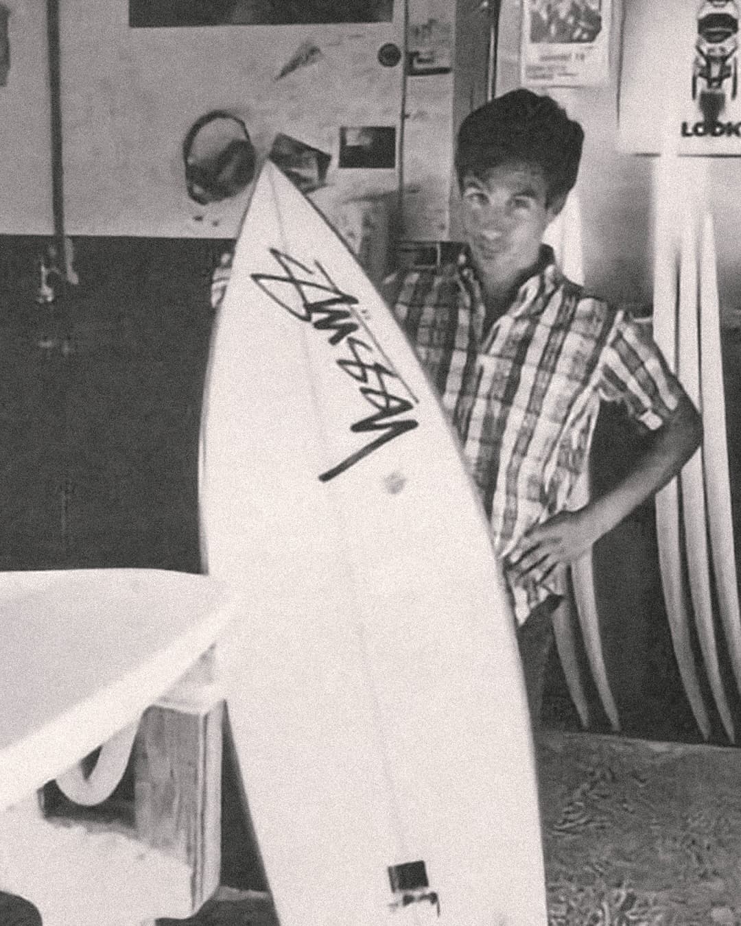 Shawn Stussy with a surfboard