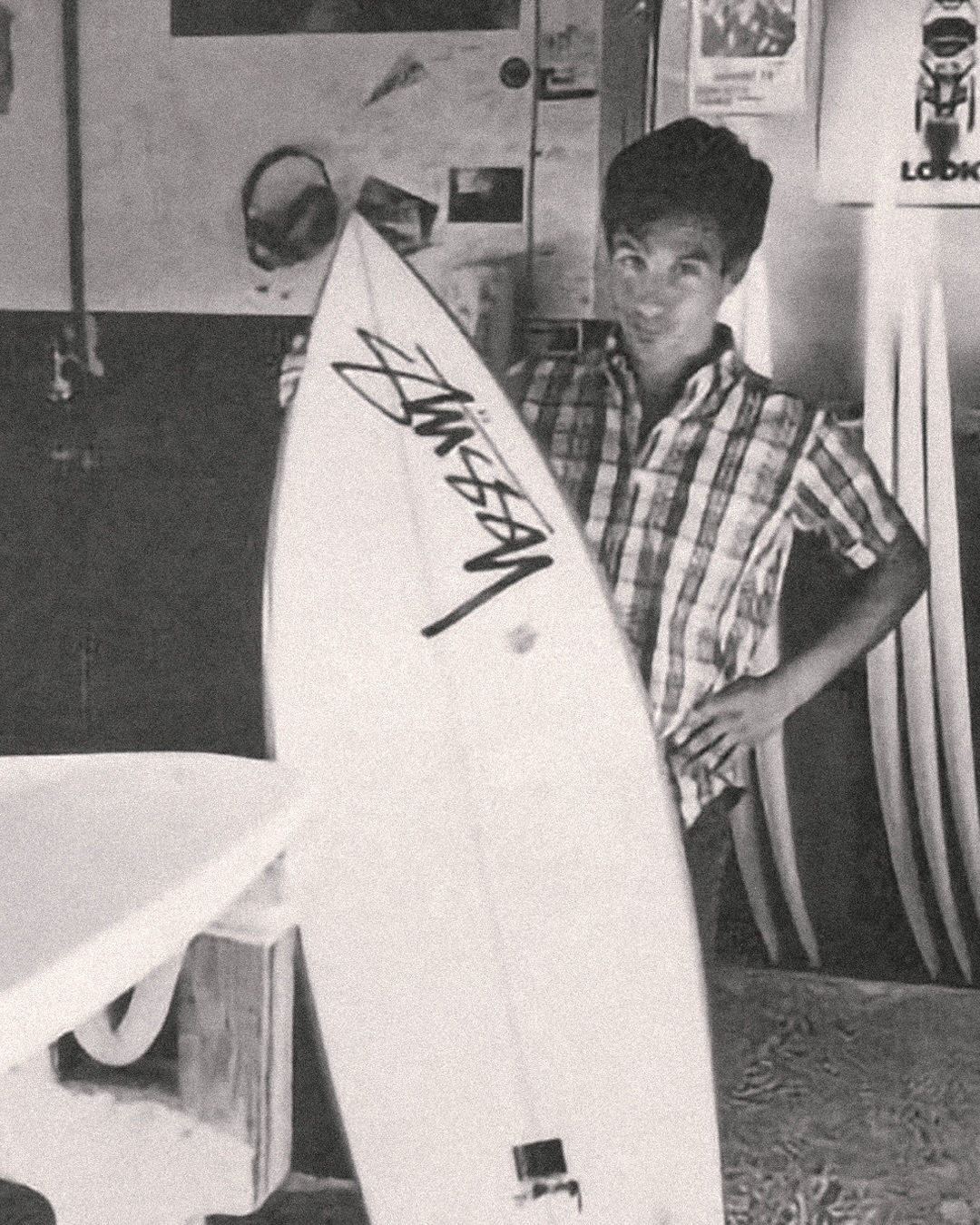 Shawn Stussy with a surfboard